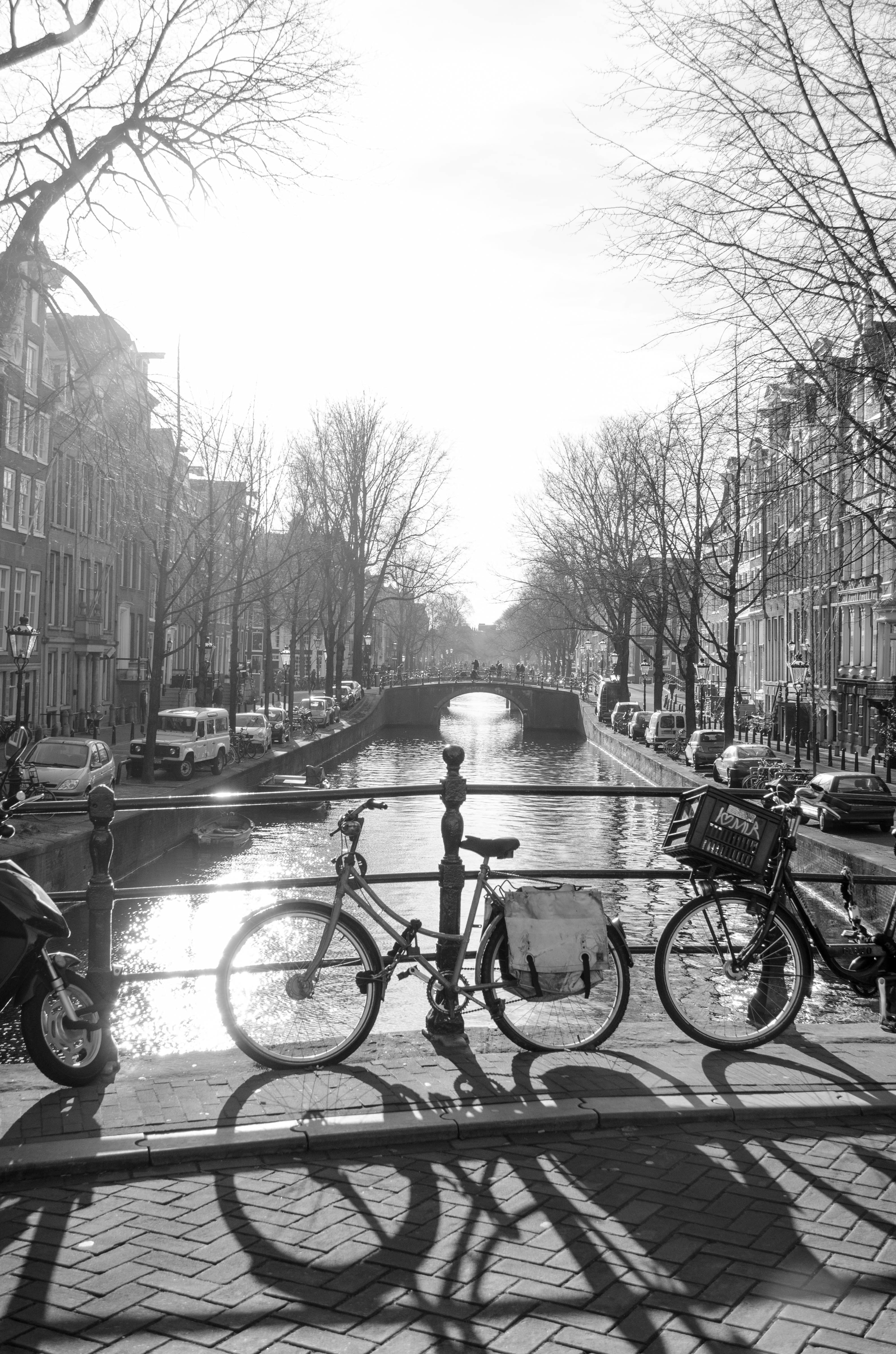 a black and white photo of the beautiful and historic canals in the Jordaan district of Amsterdam