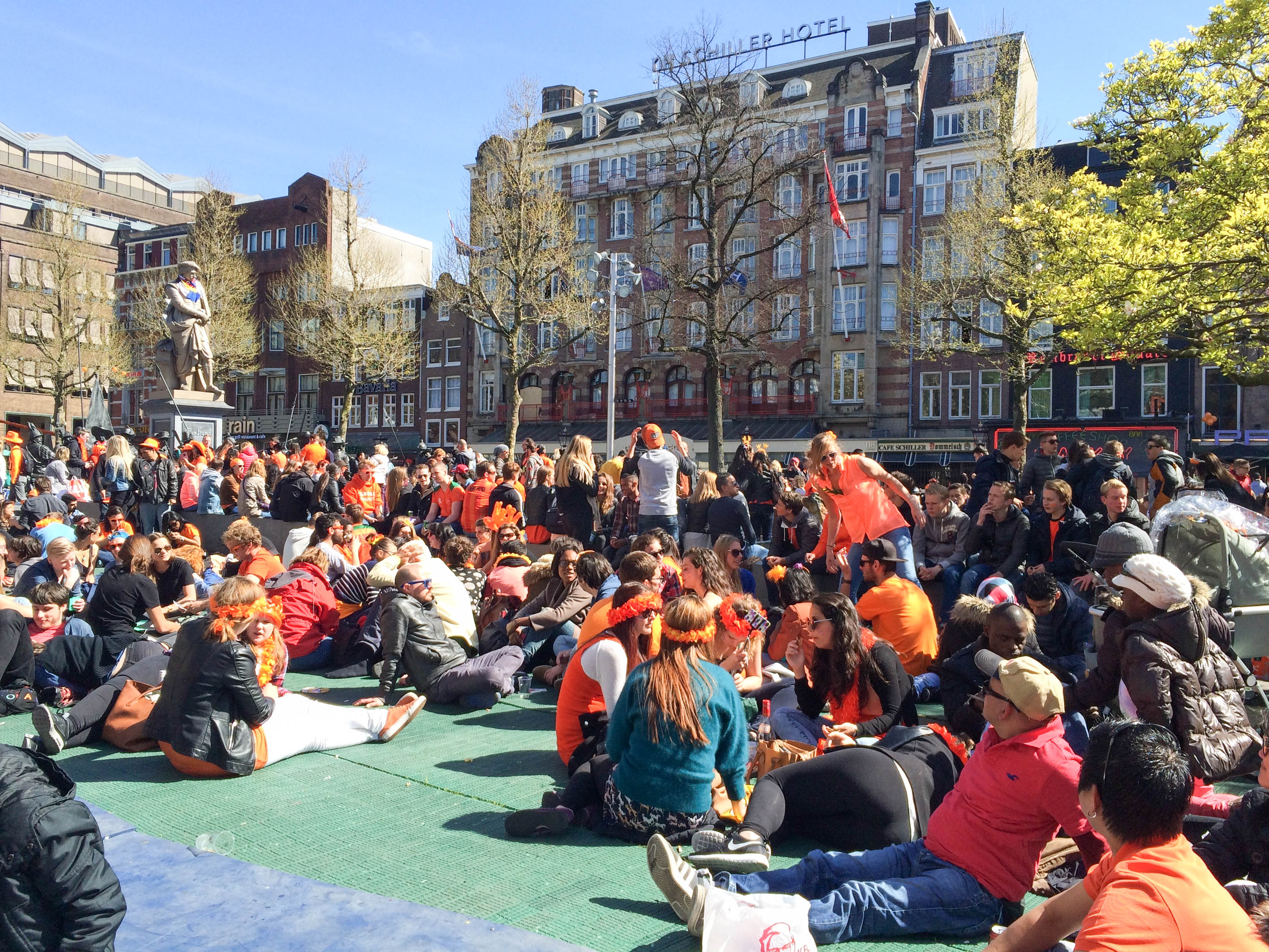 Rembrandtplein in Amsterdam becomes choked with people as tourists from all over the world descend up on the capital of the Netherlands to celebrate King Willem Alexander's birthday on Koningsdag
