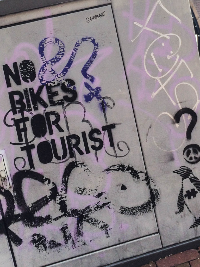 no bikes for tourist graffiti near the Magere bridge and the Hermitage Museum in Amsterdam